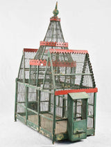 Historical green and red birdcage