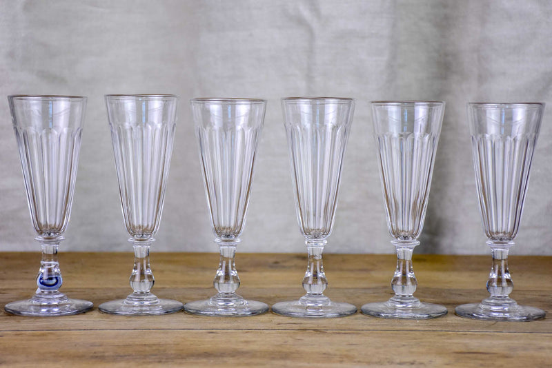 Six antique Baccarat champagne flutes