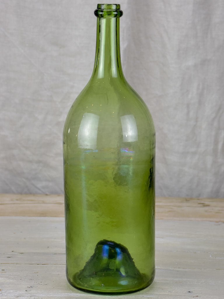 Antique French green glass bottle