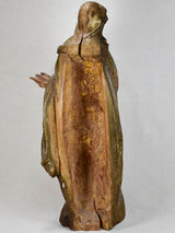 Repainted face religious wooden sculpture