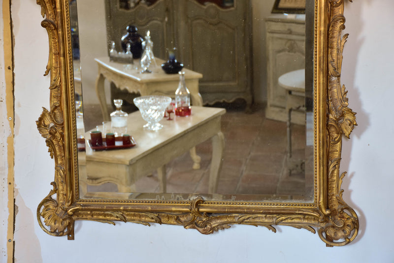 19th century Napoleon III gilded mirror with decorative crest