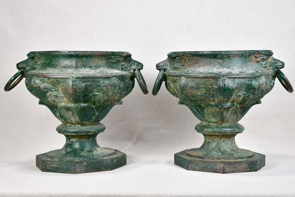 Pair of cast iron garden urns with green patina