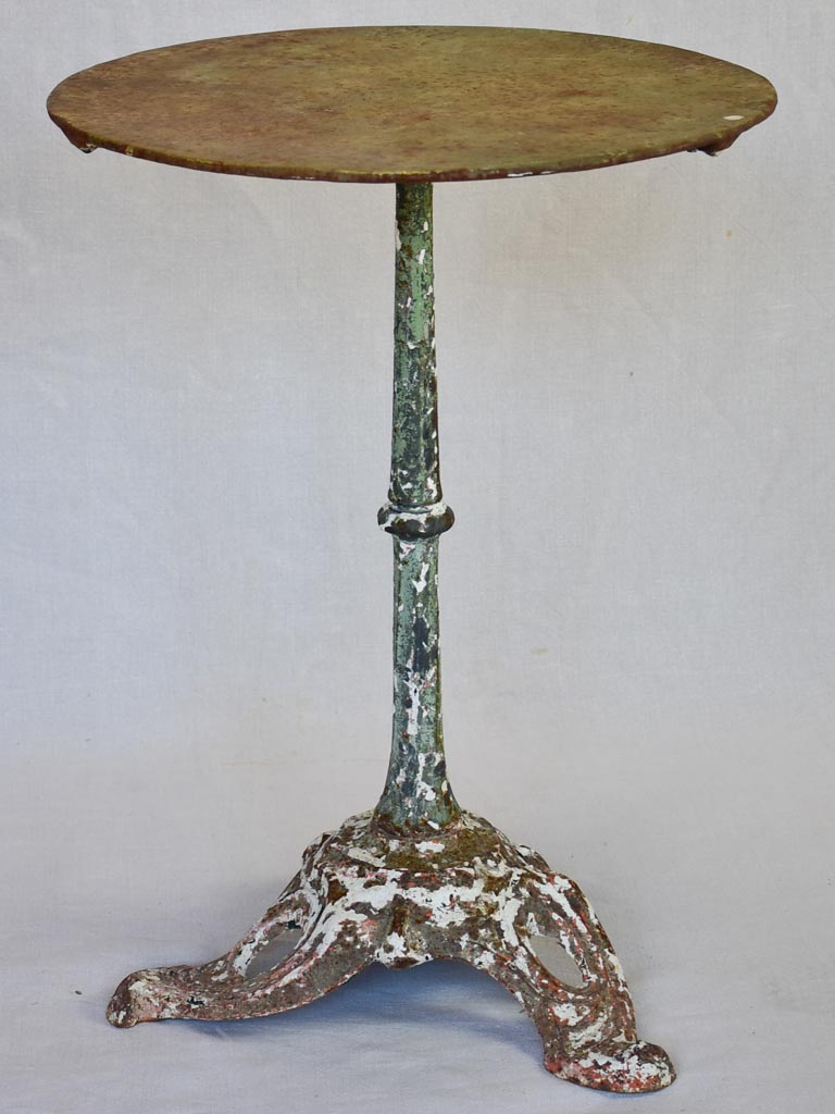 Art Nouveau bistro table with red and green patina