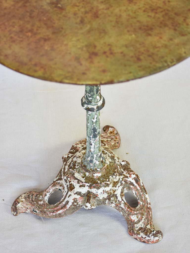 Art Nouveau bistro table with red and green patina