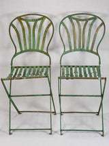 Pair of folding chairs from the military with green patina
