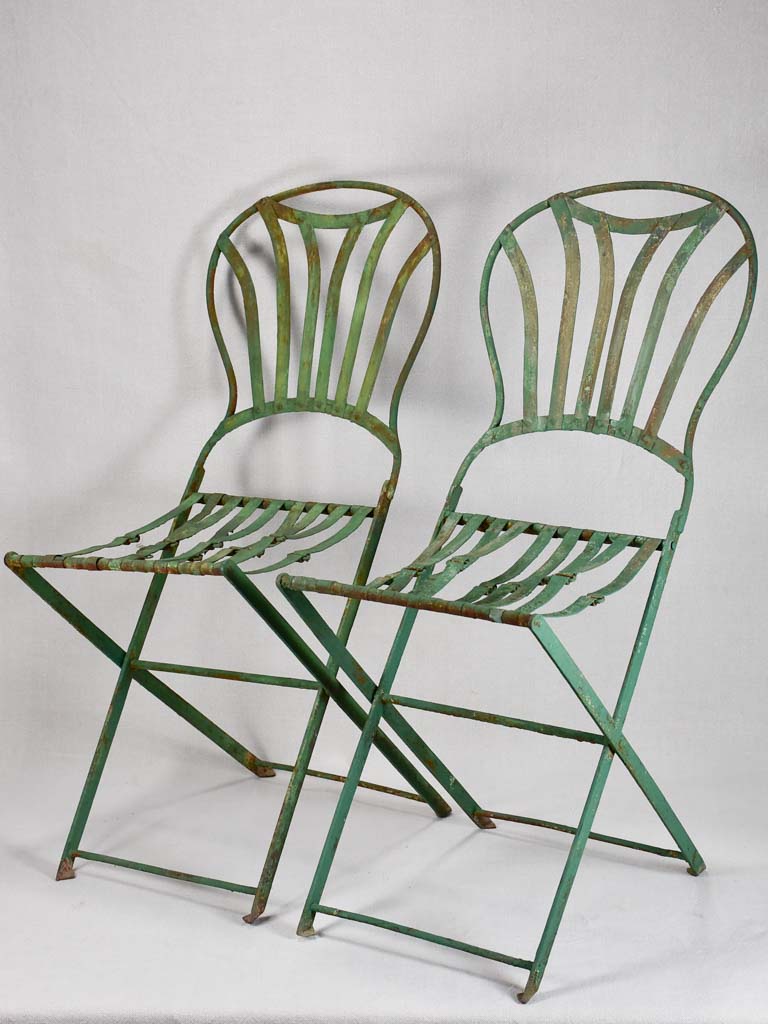 Pair of folding chairs from the military with green patina