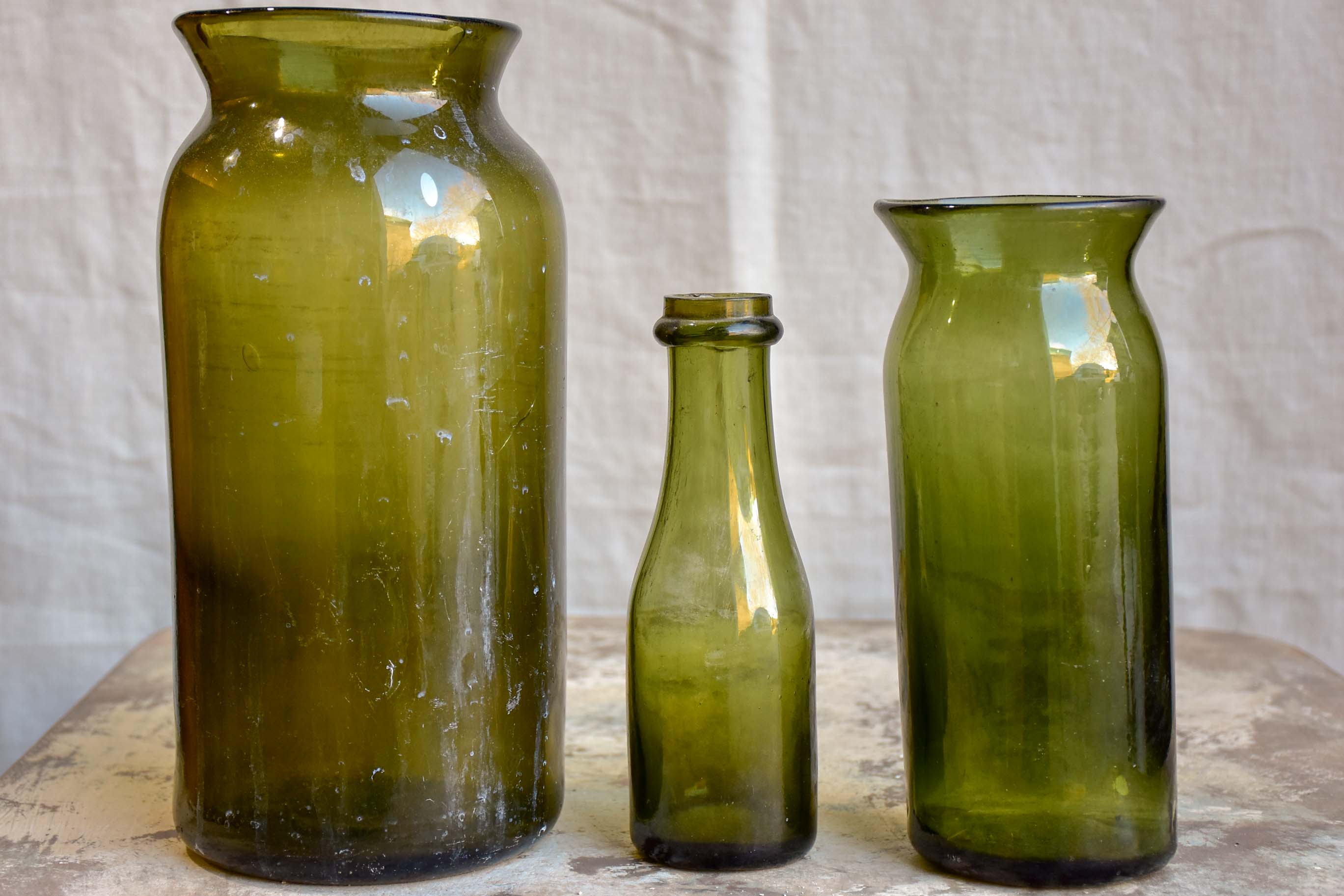 Three gueulard green French antique preserving bottles