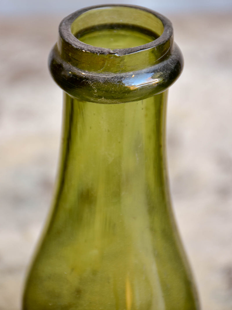 Three gueulard green French antique preserving bottles