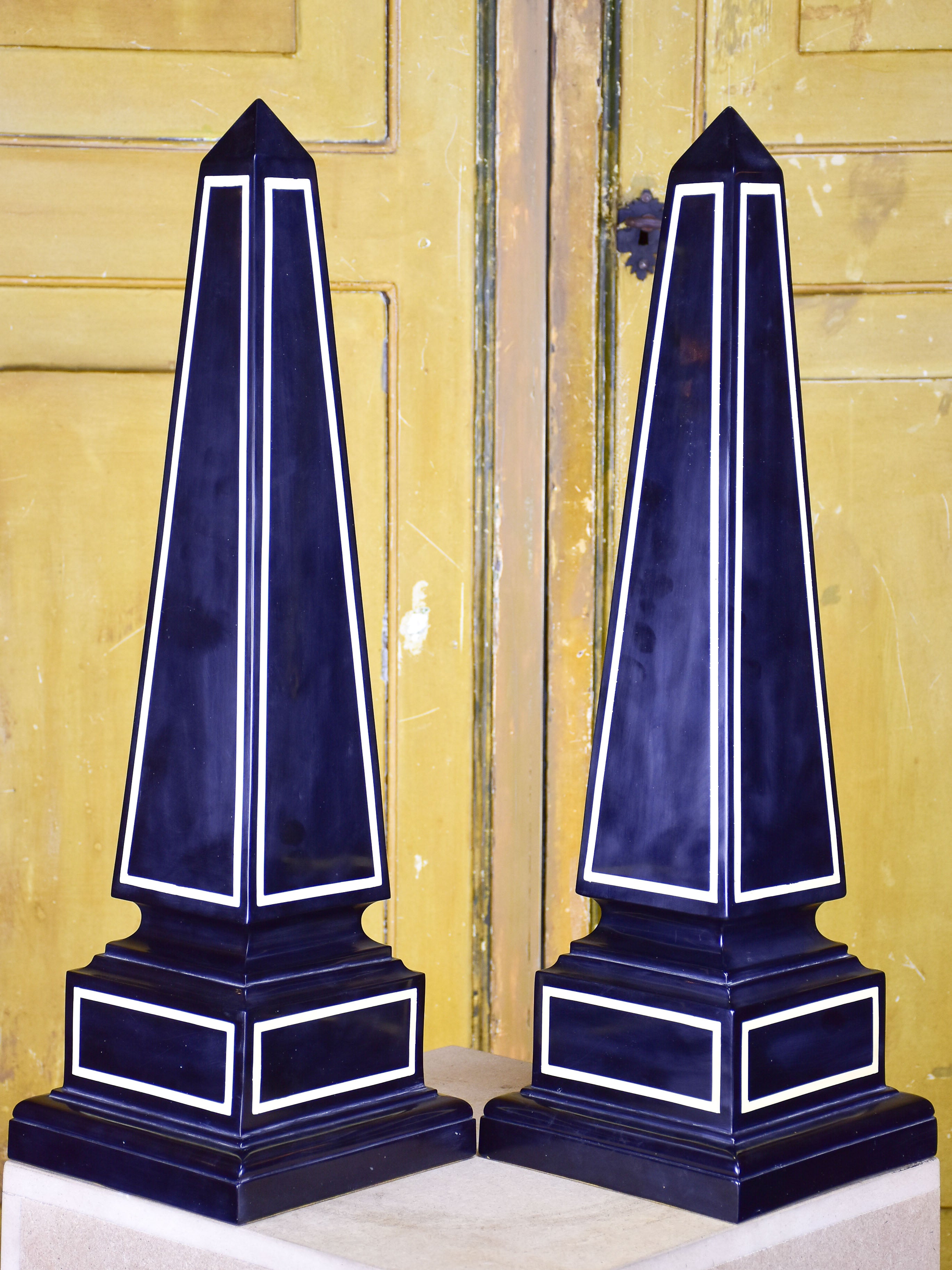 Pair of black Maison Jansen resin obelisks