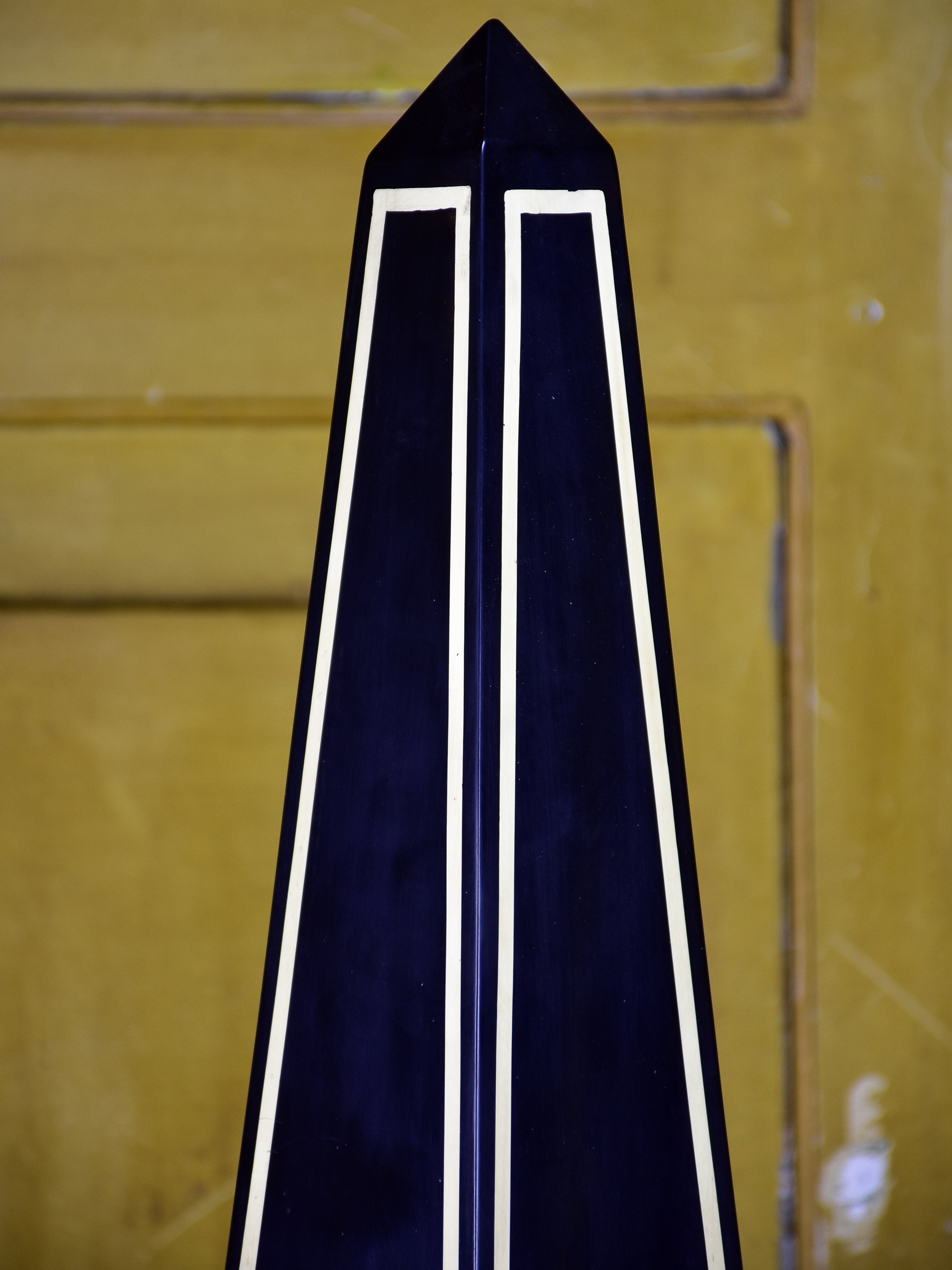 Pair of black Maison Jansen resin obelisks