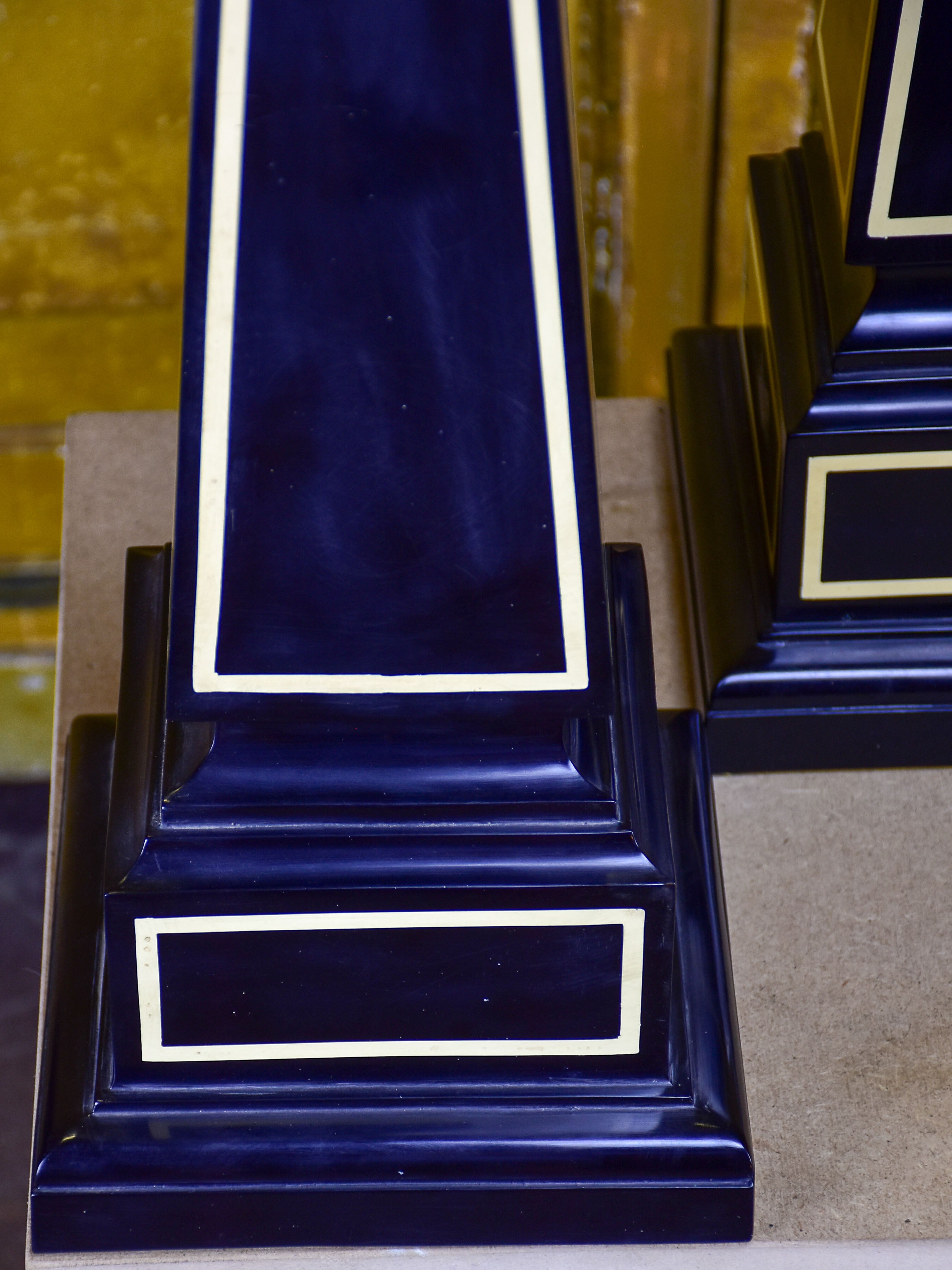 Pair of black Maison Jansen resin obelisks