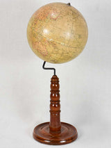 Early 20th-century spinning world globe on wooden stand 20"