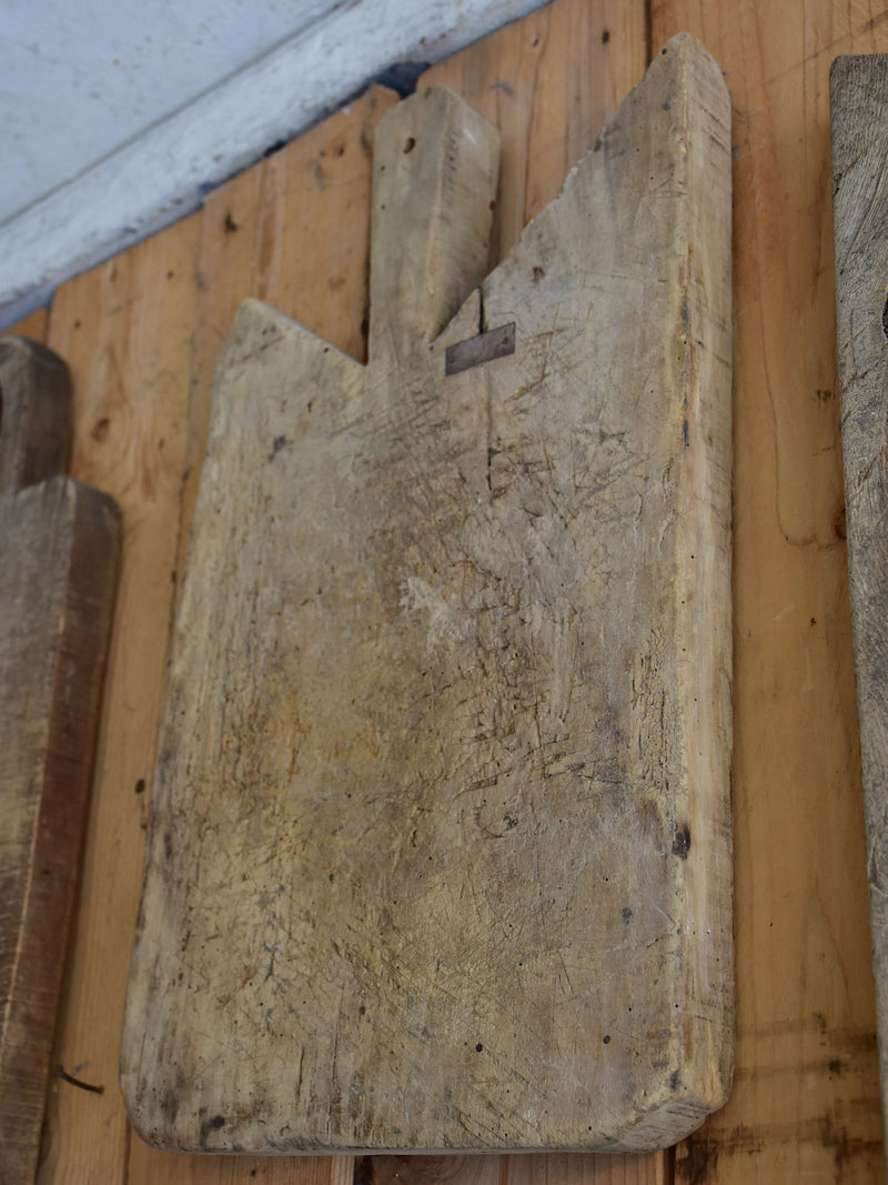Antique French cutting board with repairs and angled corners
