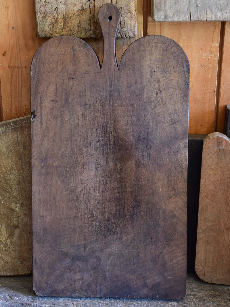 Antique French cutting board with dark timber