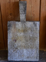 Very chunky antique French cutting board with triangular handle