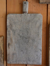 Antique French cutting board with beveled corners and grey timber
