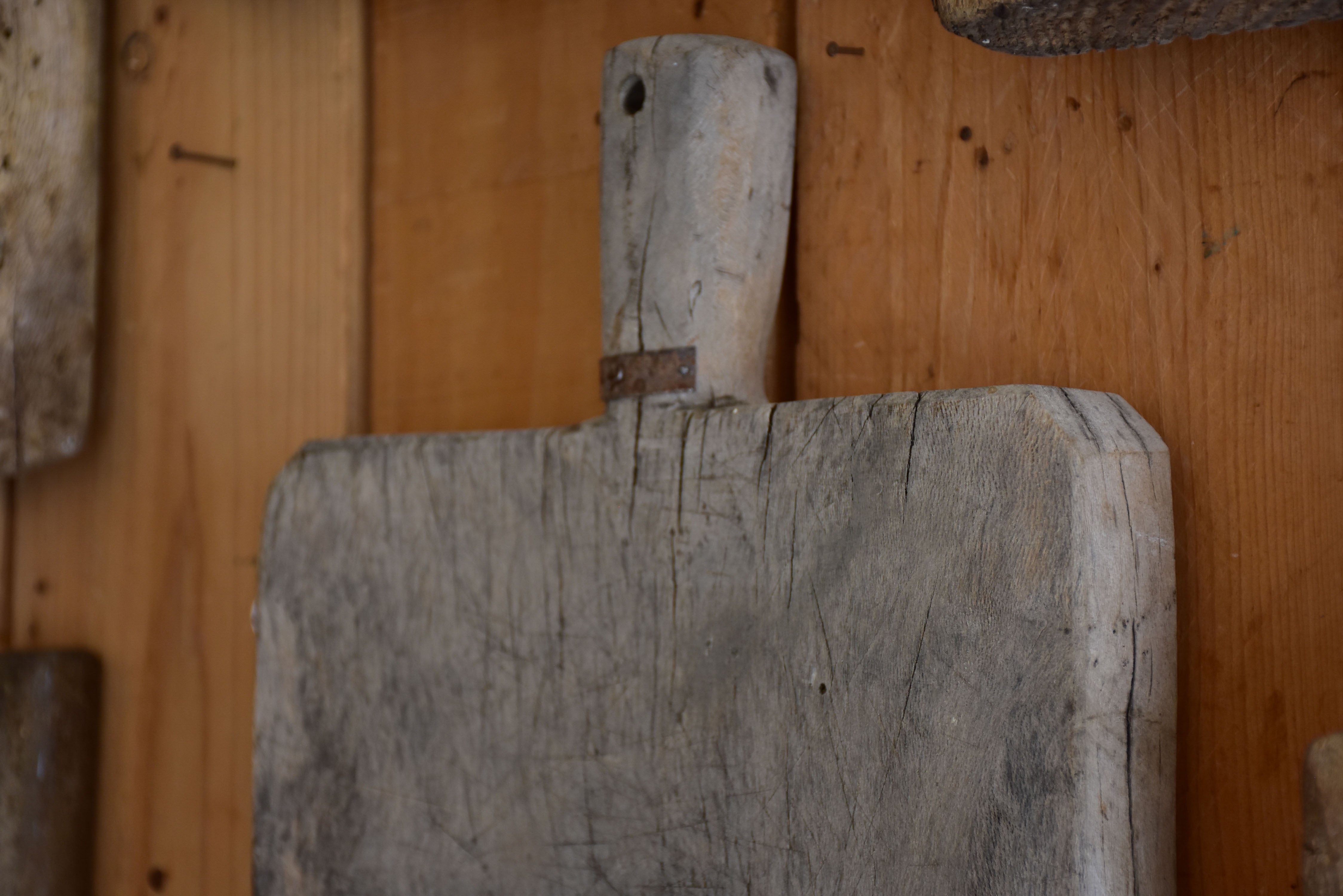Antique French cutting board with beveled corners and grey timber