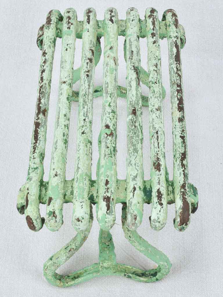 Antique garden footrest with green patina