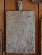 Antique French cutting board with beveled corners and grey timber