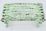 Antique garden footrest with green patina