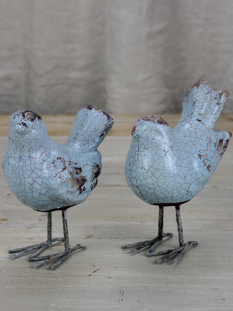 Two artisan made bird sculptures