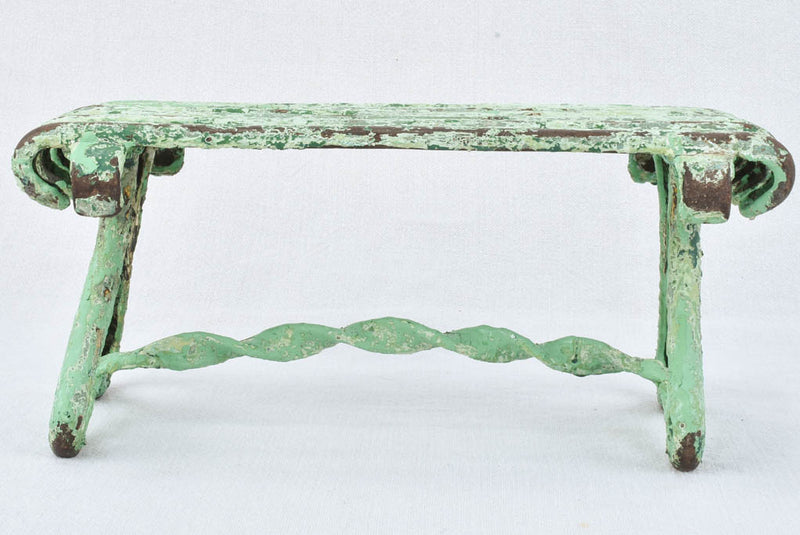 Antique garden footrest with green patina