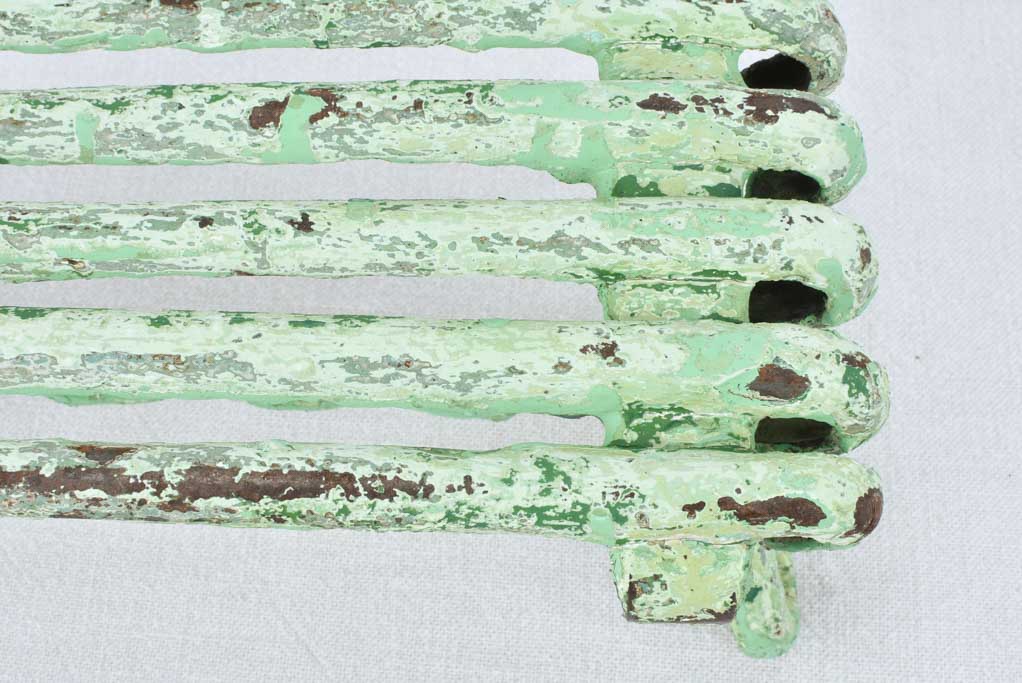 Antique garden footrest with green patina