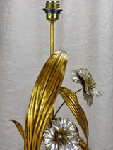 Aged patina flower-adorned metal lamp