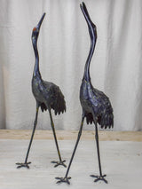 Two vintage garden sculptures of ibis