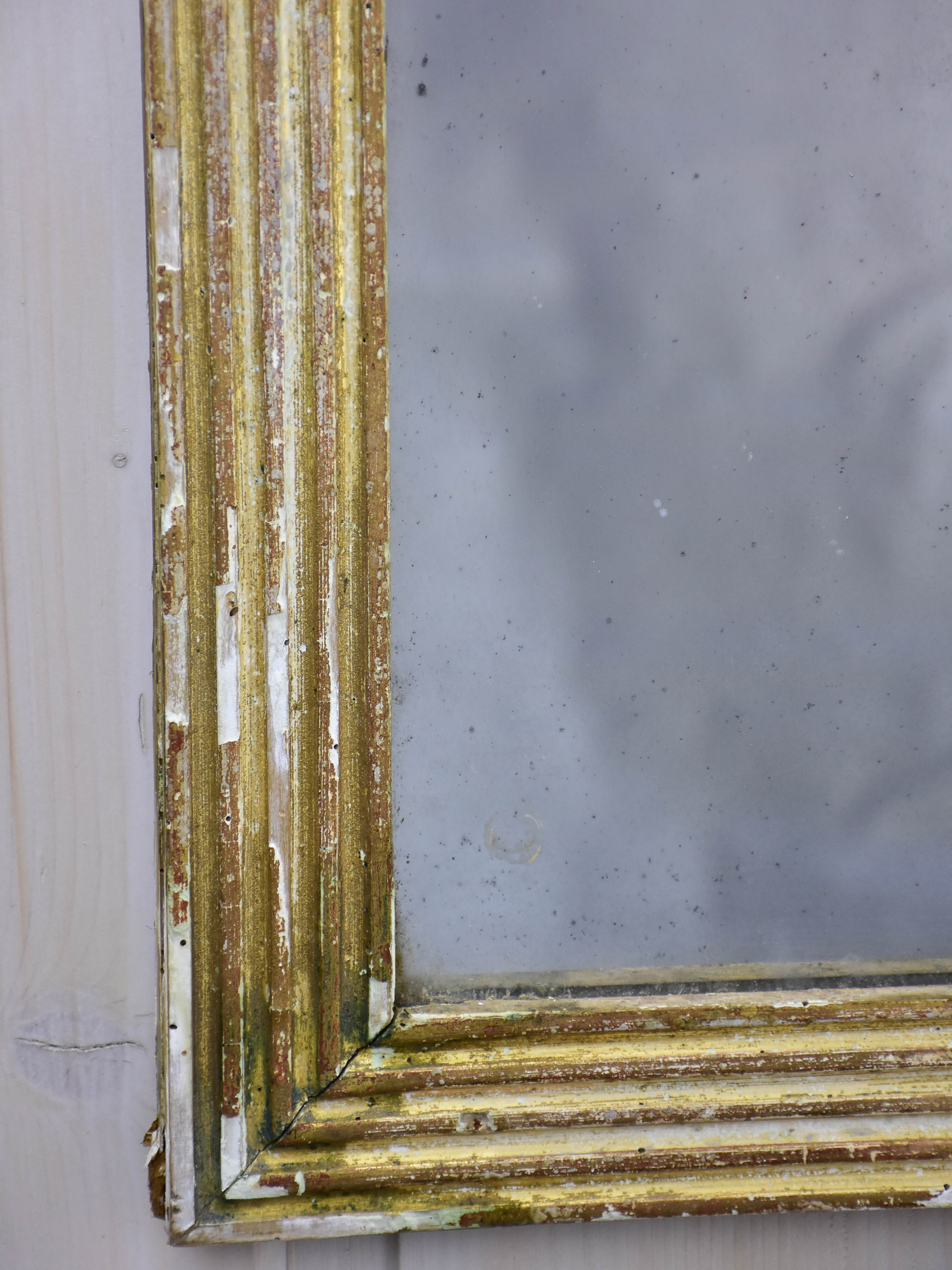 Antique Louis XVI mirror with reeded frame