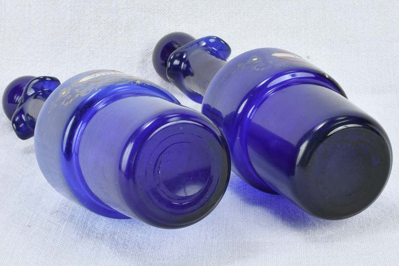 Blue glass oil and vinegar carafes 10¾"