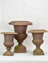 Three antique French cast iron Medici urns