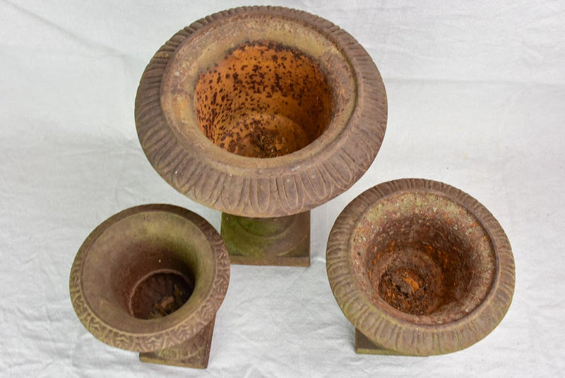 Three antique French cast iron Medici urns