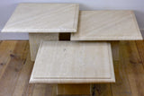 Three vintage travertine nesting side tables