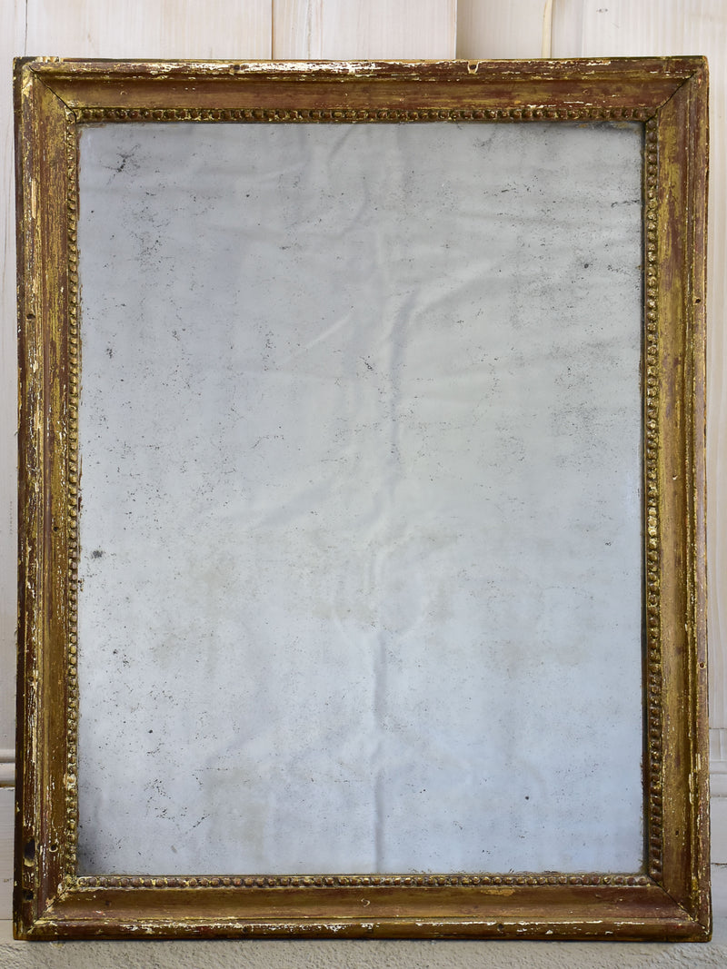 Rustic Louis XVI mirror with gilded frame