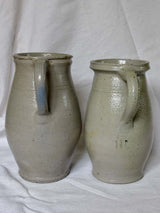 Two antique French milk pitchers - gray sandstone