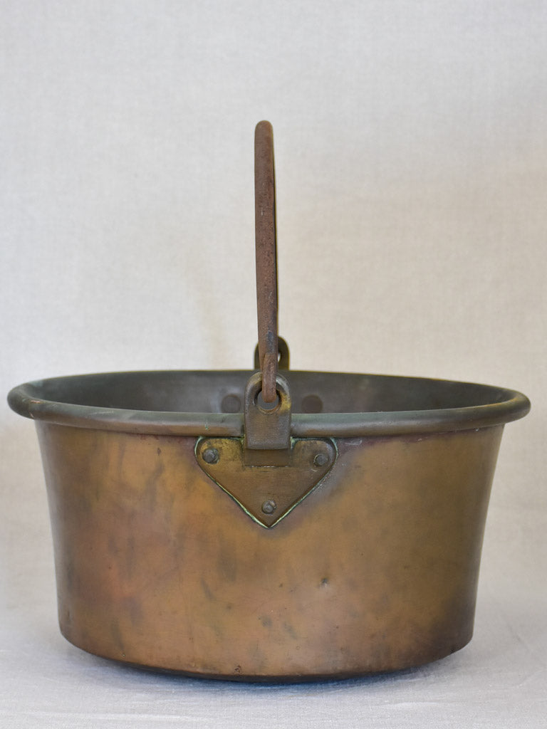 Broad French winemaker's copper with arching handle from the 19th century 17¼"