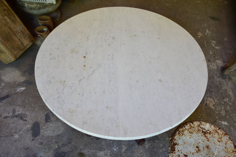 Round marbletop table with cast iron base Chez Pluie