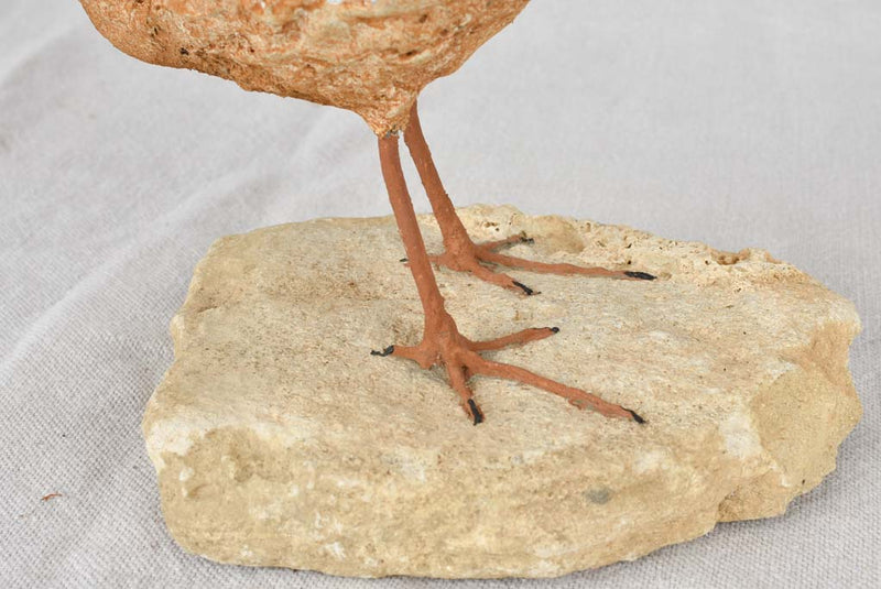 Artisan-made sculpture of a bird on a rock 8¾"