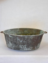 Broad antique French cauldron with two small handles and a drainage hole 30¼"