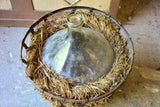 Very large antique French demijohn bottle in hay and crate
