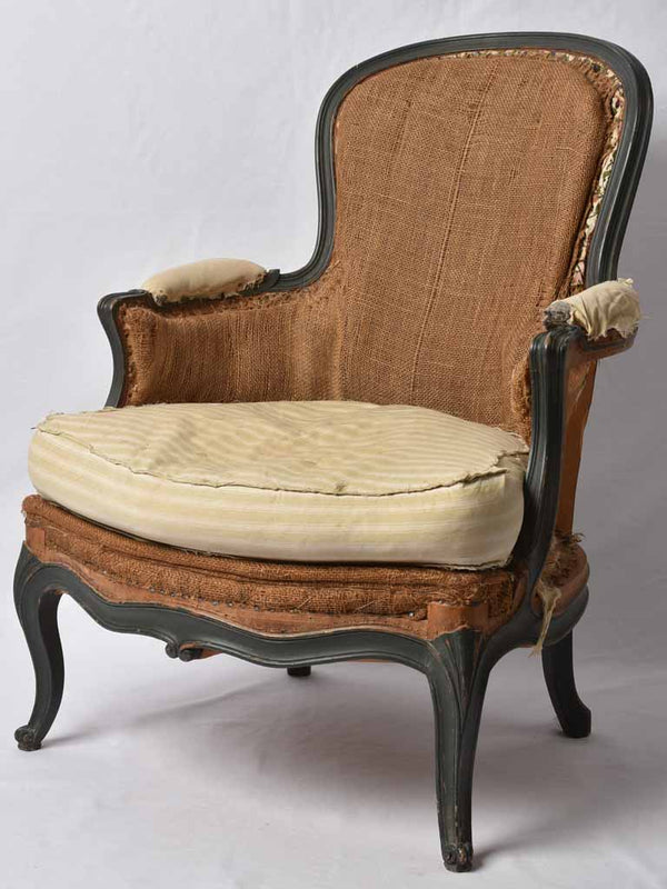 Rustic Louis XV style round back bergère armchair