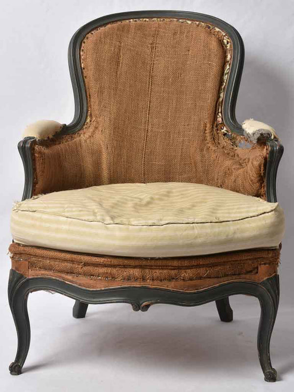 Distressed round back bergère armchair
