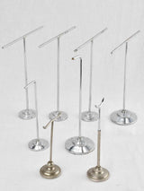 Collection of 8 antique jewelry display racks