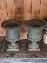 Pair of antique Medici urns with dark green patina