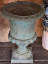Pair of antique Medici urns with dark green patina