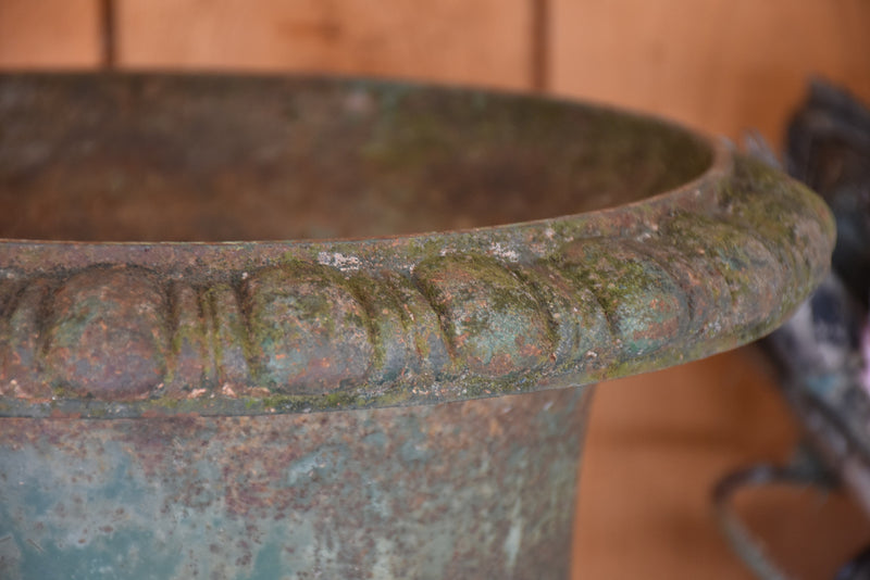 Pair of antique Medici urns with dark green patina