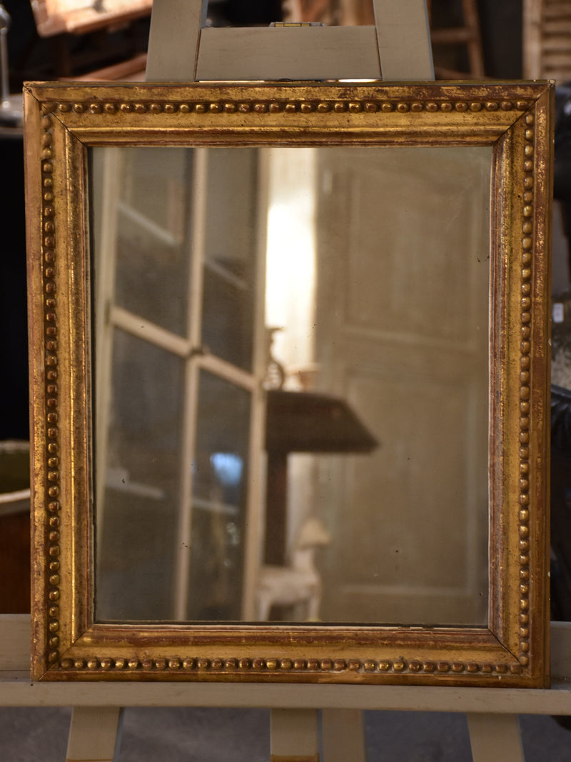 Petite early 19th century gilded French mirror