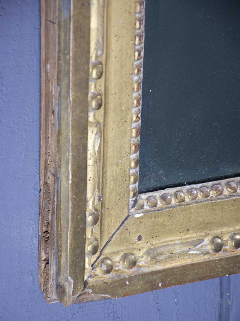 Louis XVI mirror with gilded frame and mercury glass