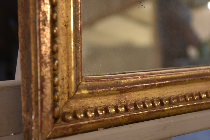 Petite early 19th century gilded French mirror
